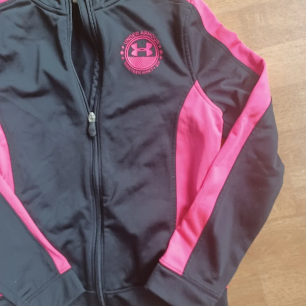 Under Armour youth size large pink and black